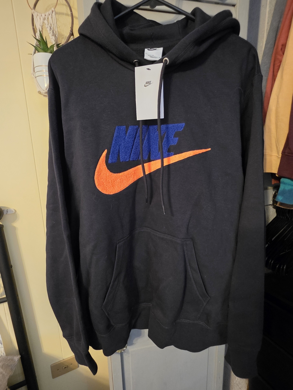 Nike Black Pullover Hoodie with Blue Nike Text and Orange Swoosh